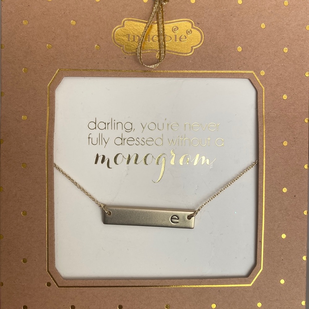 Never opened or worn monogram “e” necklace